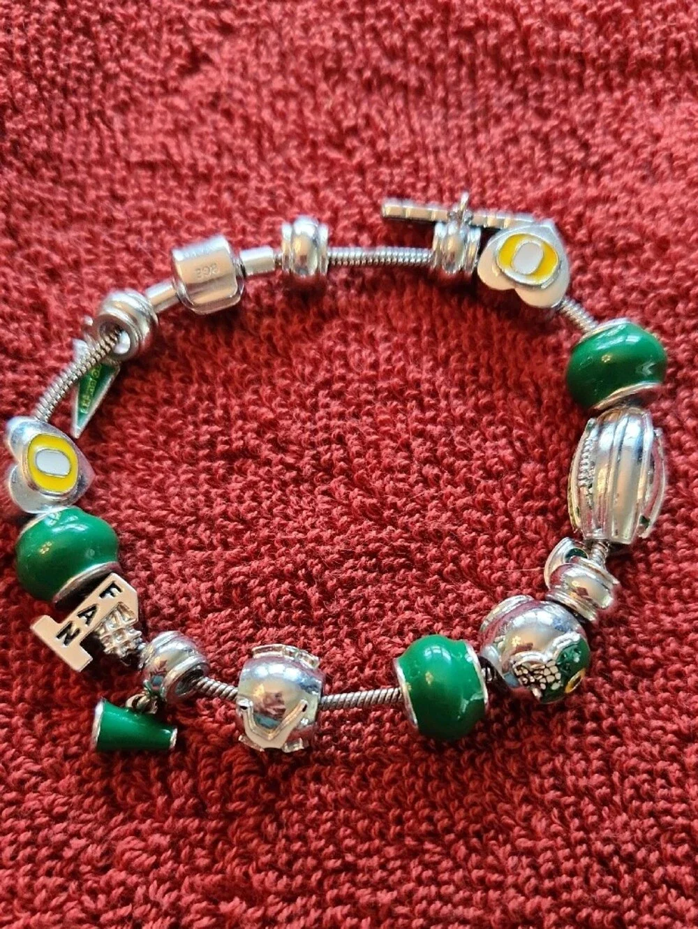 Silver Color Charm Bracelet with Green Beads and Sports Accents